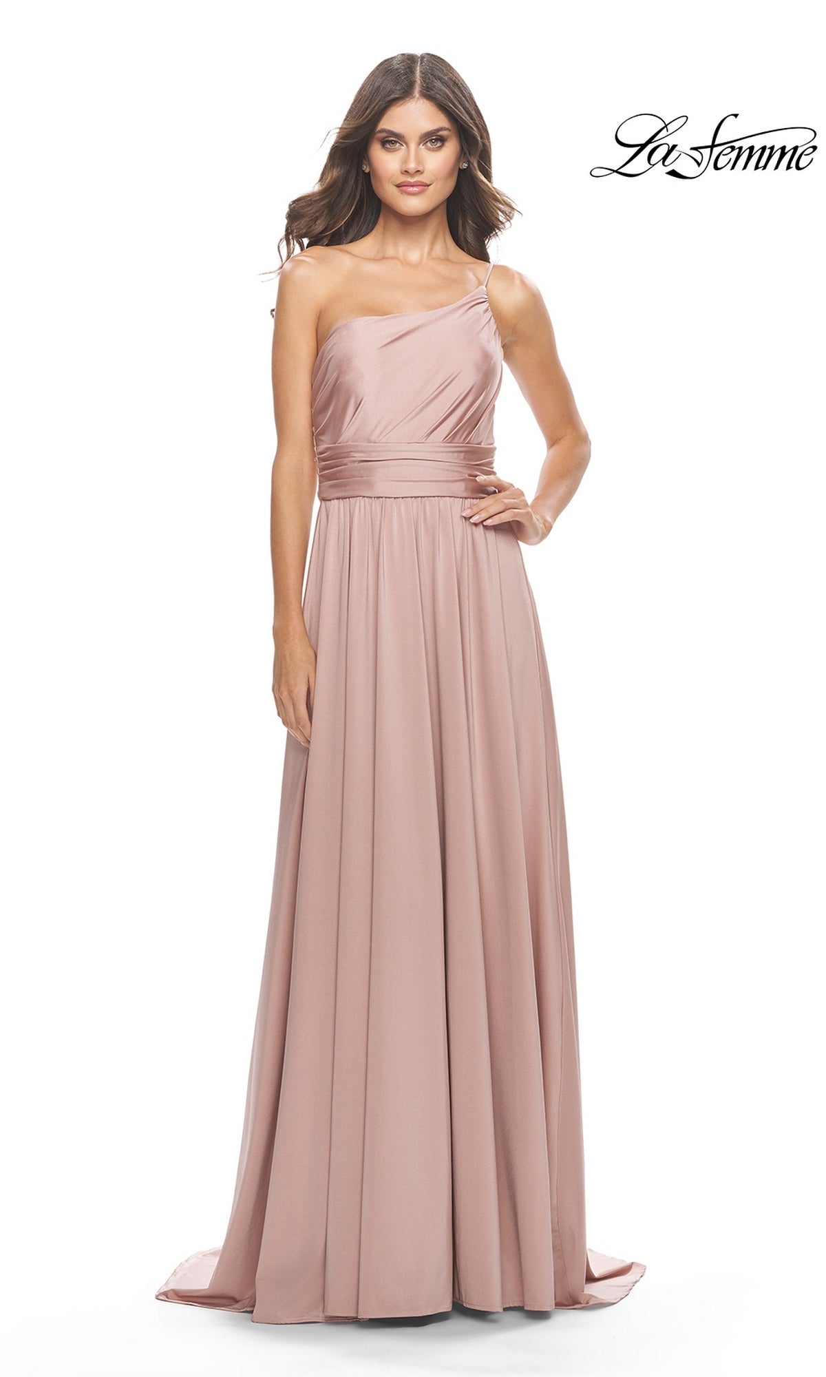 Woman models the One-Shoulder Long La Femme Formal Dress 31170 in blush pink, featuring a fitted bodice and flowing, floor-length skirt, against a plain white background with the